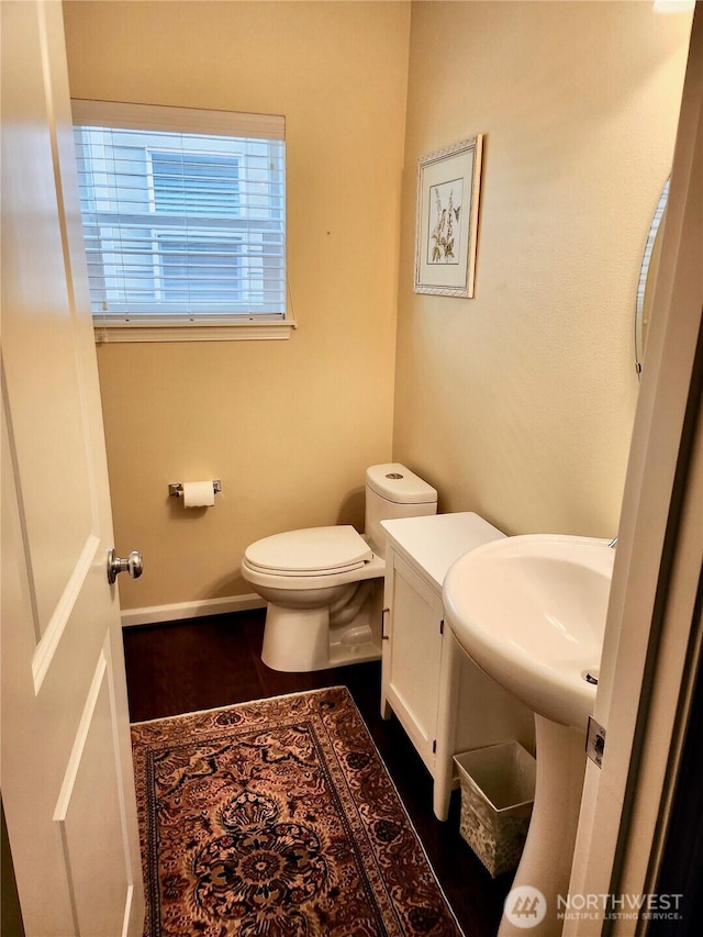 4405 31st Ave SE, Everett, WA 98203 - bathroom featuring toilet, wood finished floors, and baseboards