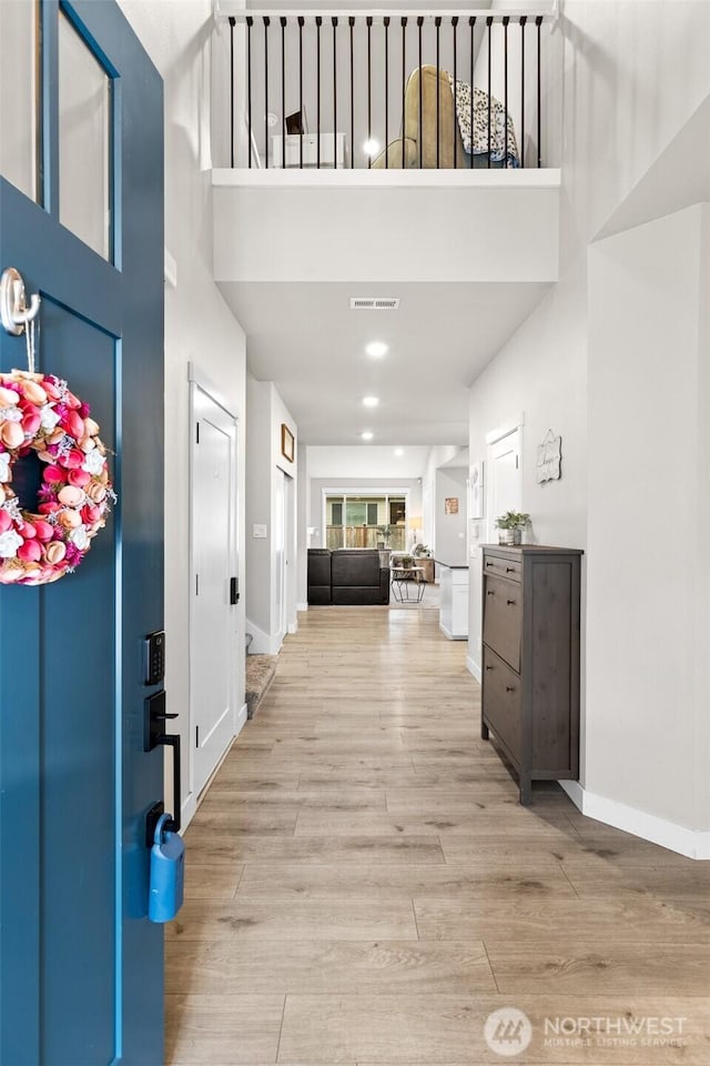 6620 165th Street Ct E, Puyallup, WA 98375 - entryway with a towering ceiling, light wood-type flooring, baseboards, and recessed lighting