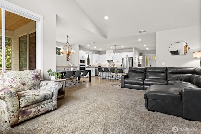 6620 165th Street Ct E, Puyallup, WA 98375 - living room featuring a chandelier, lofted ceiling, and recessed lighting