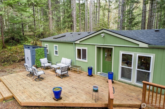 161 N Dow Mountain Rd, Hoodsport, WA 98548 - rear view of house featuring a forest view, a shingled roof, an outdoor living space, and a wooden deck