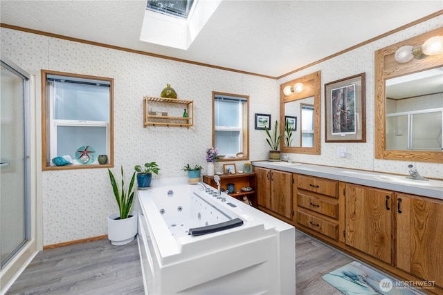 161 N Dow Mountain Rd, Hoodsport, WA 98548 - full bath with wallpapered walls, a sink, ornamental molding, and a skylight