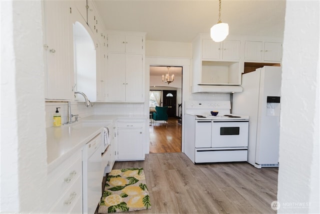 kitchen featuring white cabinetry, tasteful backsplash, light wood-type flooring, under cabinet range hood, and white appliances