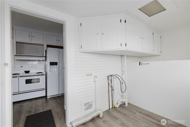 laundry area with wood finished floors and laundry area