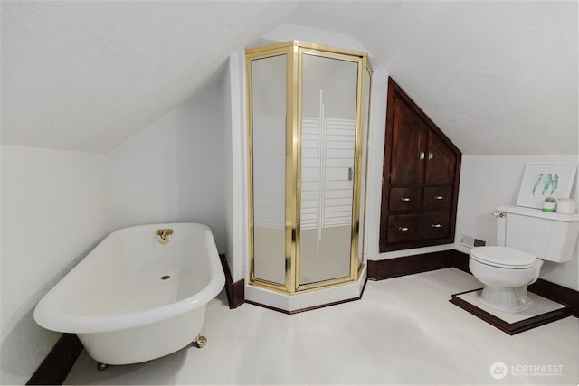 bathroom with a stall shower, a freestanding bath, toilet, and lofted ceiling