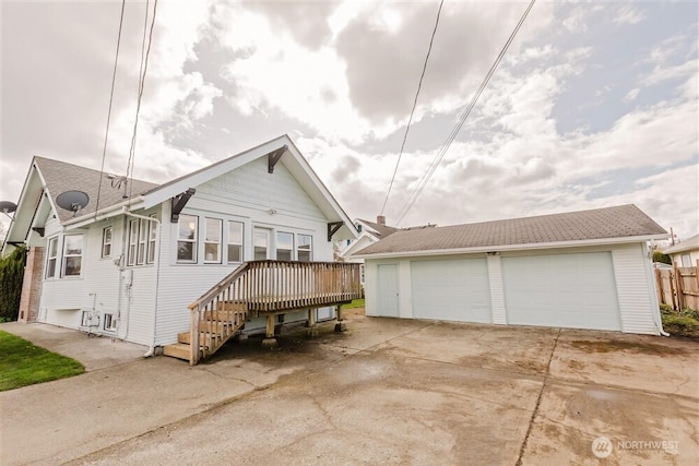 exterior space featuring an outbuilding and a garage