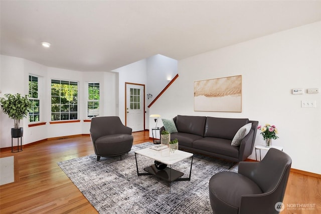 living room featuring baseboards and wood finished floors