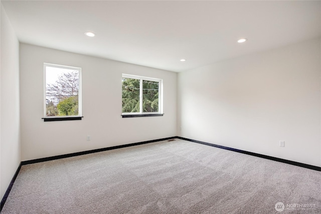 unfurnished room with baseboards, carpet, and recessed lighting