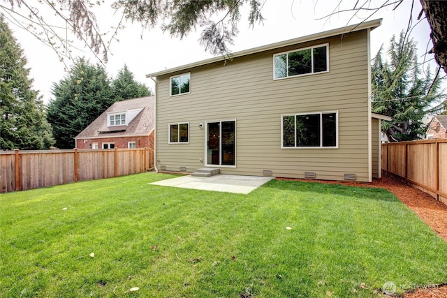rear view of house featuring a fenced backyard, a patio, a yard, and crawl space