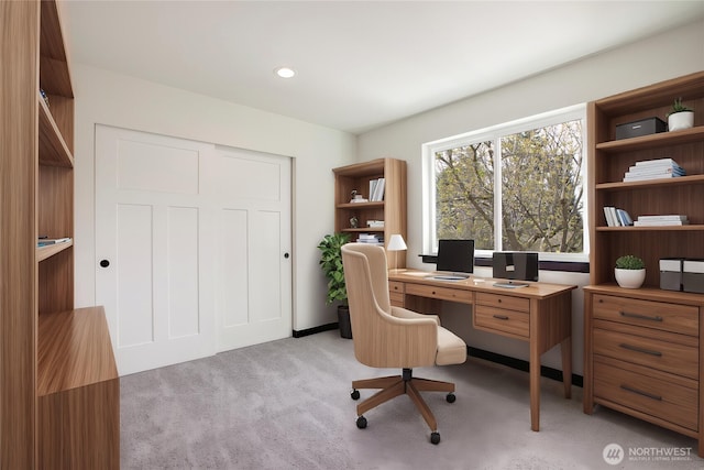 office with recessed lighting and light colored carpet