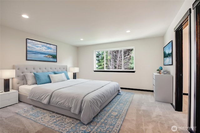 bedroom featuring baseboards, recessed lighting, and light colored carpet