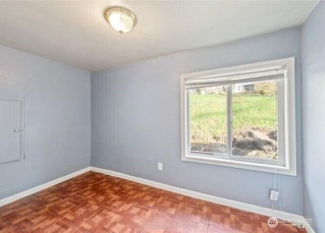 10601 55th Ave S, Seattle, WA 98178 - spare room featuring baseboards