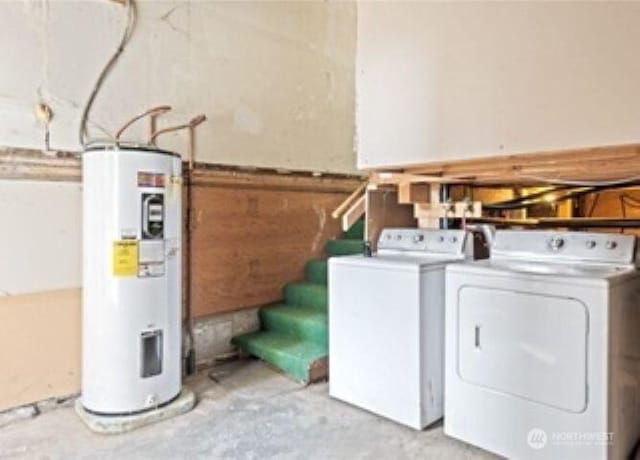 10601 55th Ave S, Seattle, WA 98178 - laundry room featuring water heater, wood walls, wainscoting, laundry area, and independent washer and dryer