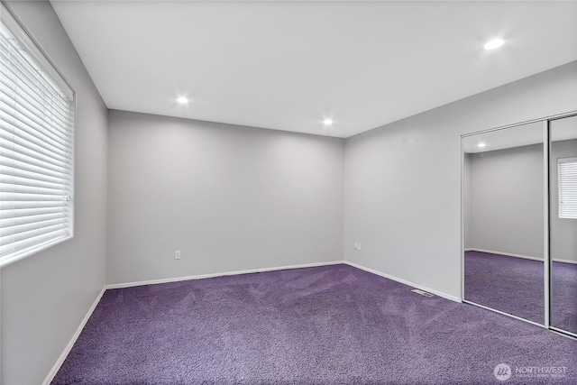 unfurnished bedroom with baseboards, carpet floors, and recessed lighting