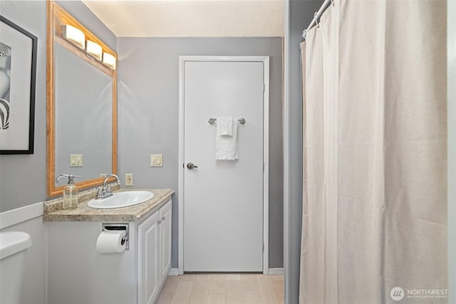 full bathroom with vanity and toilet