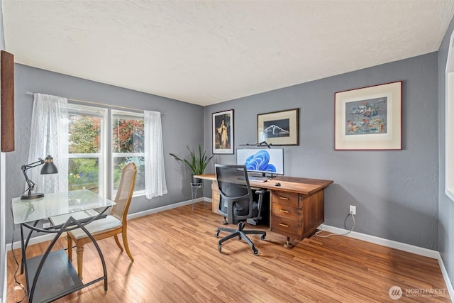 office area featuring wood finished floors and baseboards