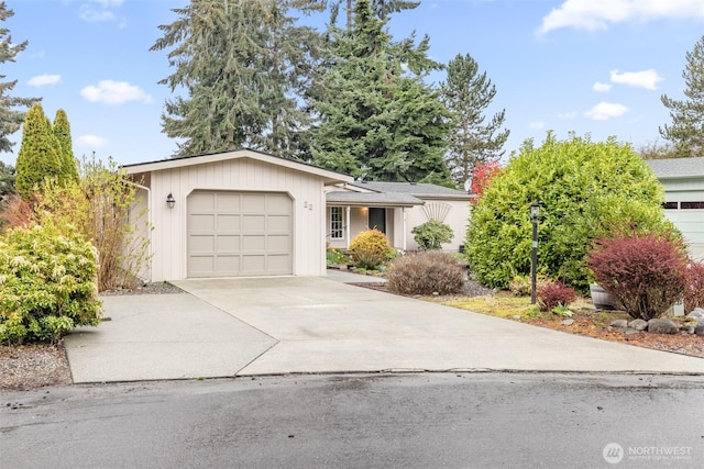 single story home with an attached garage and concrete driveway
