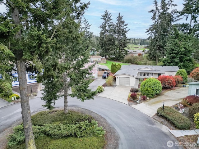 view of front of property featuring driveway and an attached garage