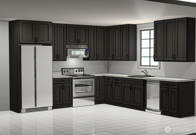 817 Lewis, Walla Walla, WA 99362 - kitchen featuring stainless steel appliances, light countertops, a sink, and dark cabinetry