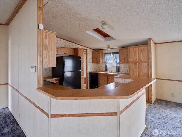 1850 Heartwood Dr, Woodland, WA 98674 - kitchen with carpet flooring, a textured ceiling, light countertops, lofted ceiling, and black appliances