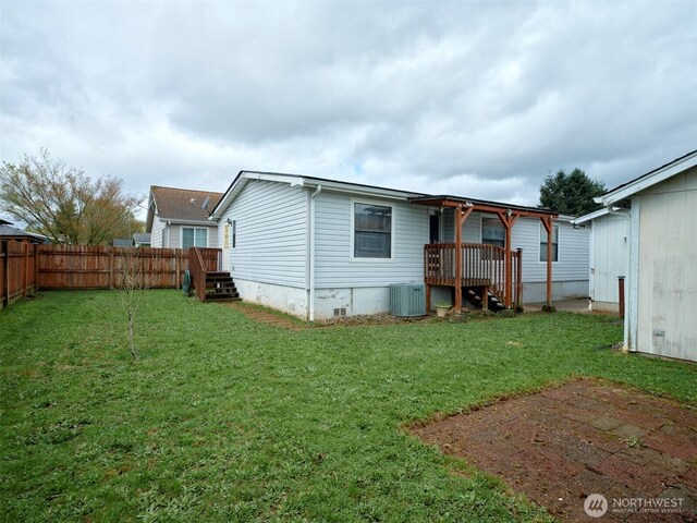 1850 Heartwood Dr, Woodland, WA 98674 - back of house with fence, central AC, and a yard