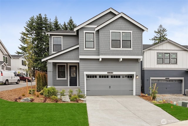 11519 SE 84th St Unit 44, Newcastle, WA 98056 - view of front of home with a garage, concrete driveway, and a front yard