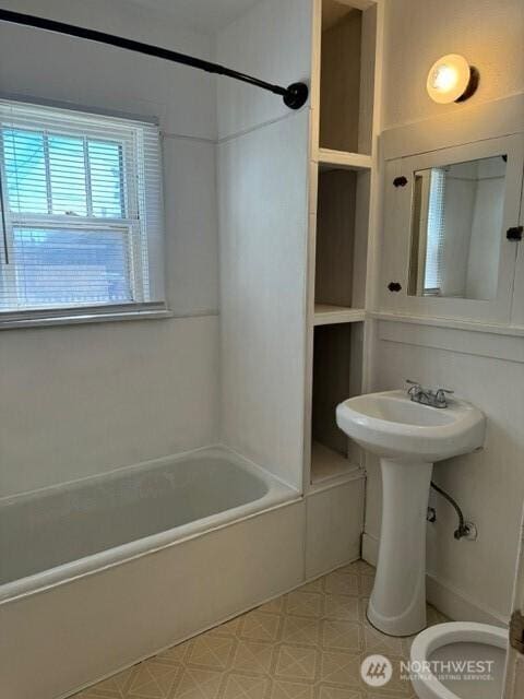 609 S 16th Ave, Yakima, WA 98902 - bathroom featuring toilet, bathtub / shower combination, and tile patterned floors