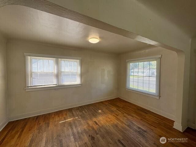 609 S 16th Ave, Yakima, WA 98902 - empty room with baseboards and wood finished floors