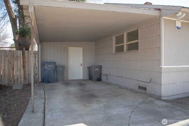 708 S Park Pl, Ellensburg, WA 98926 - exterior space featuring a carport, fence, and visible vents
