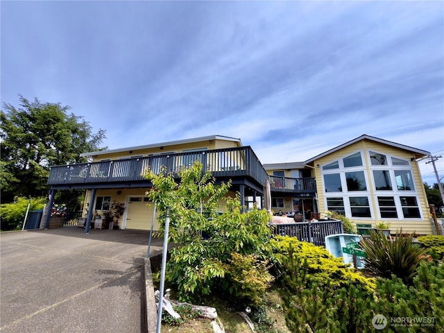 200 Ocean Lake Way NW, Ocean Shores, WA 98569 - view of property with concrete driveway and an attached garage