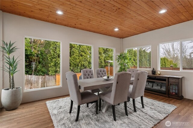 dining area with wood finished floors, wood ceiling, and recessed lighting