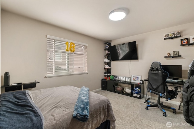 carpeted bedroom featuring baseboards