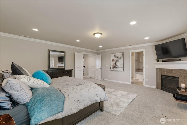 bedroom featuring light carpet, baseboards, a tiled fireplace, and ornamental molding