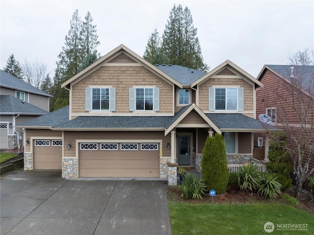 craftsman-style home with stone siding, driveway, a garage, and covered porch
