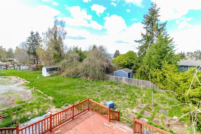 view of yard featuring fence and a wooden deck