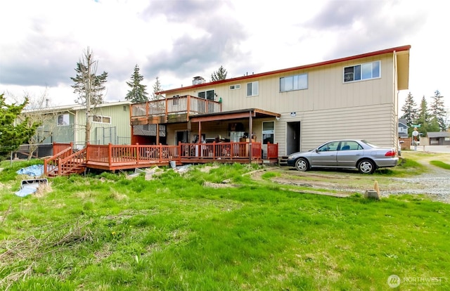 rear view of property with a deck