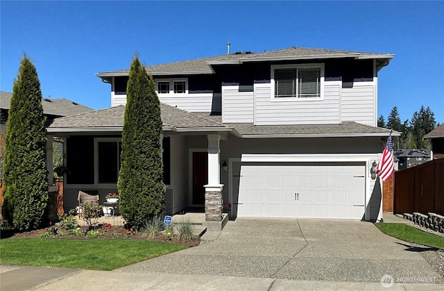 10211 Sentinel Loop, Gig Harbor, WA 98332 - view of front facade featuring an attached garage, concrete driveway, fence, and roof with shingles