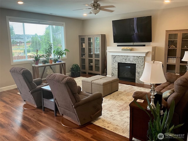10211 Sentinel Loop, Gig Harbor, WA 98332 - living area with a ceiling fan, wood finished floors, a glass covered fireplace, and recessed lighting