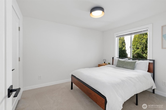 14327 Fremont Ave N, Seattle, WA 98133 - bedroom with light carpet and baseboards