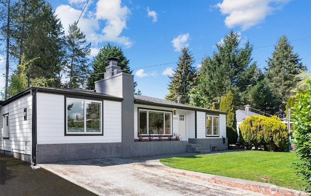 14327 Fremont Ave N, Seattle, WA 98133 - view of front facade with a front lawn, a chimney, and brick siding