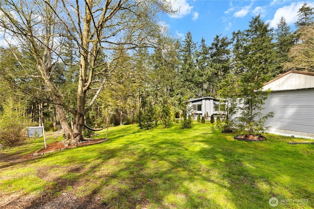 view of yard featuring a garage