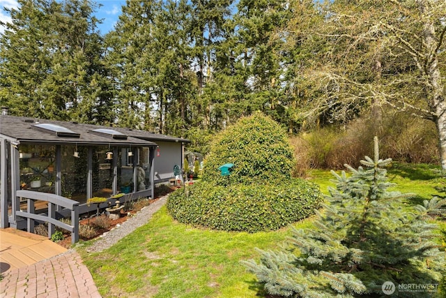 view of yard featuring a sunroom