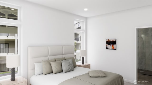 bedroom featuring baseboards, ensuite bathroom, and recessed lighting