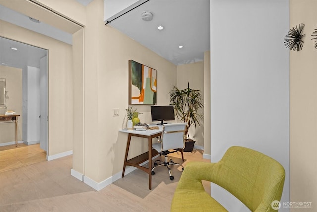 home office featuring baseboards, recessed lighting, and light wood-style flooring