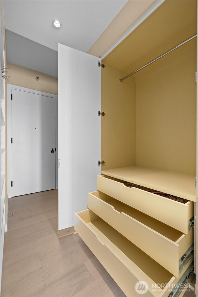 staircase featuring recessed lighting and wood finished floors