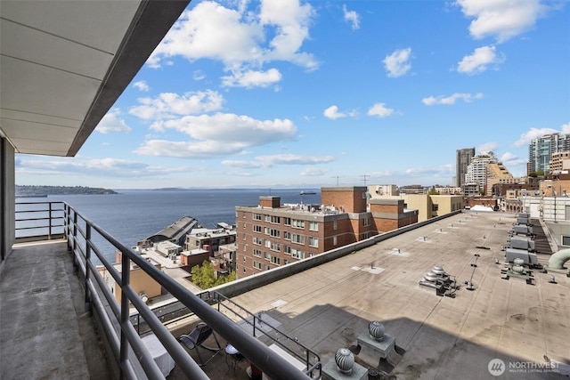 balcony featuring a view of city and a water view