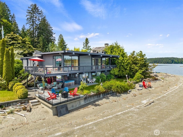 9716 Hunter Point Rd NW, Olympia, WA 98502 - rear view of house with stairs and a deck with water view