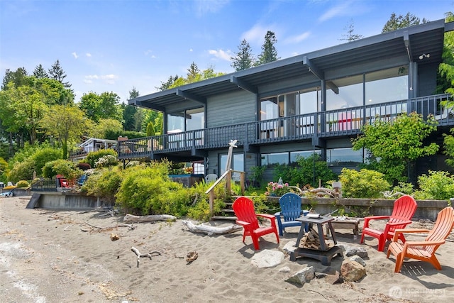 9716 Hunter Point Rd NW, Olympia, WA 98502 - back of property with an outdoor fire pit