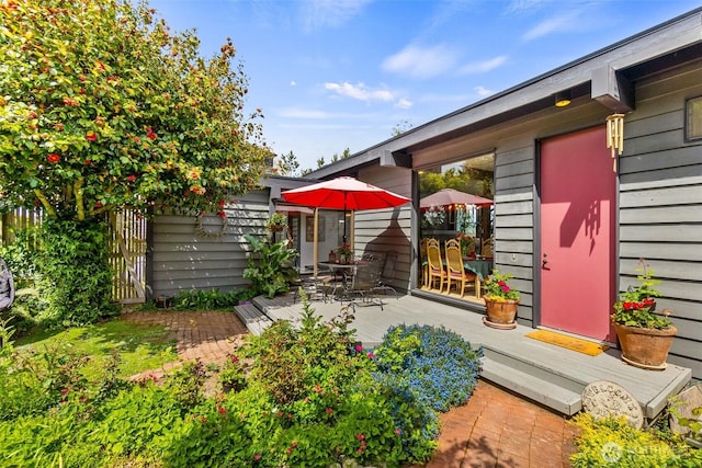 9716 Hunter Point Rd NW, Olympia, WA 98502 - view of yard with a wooden deck and outdoor dining area