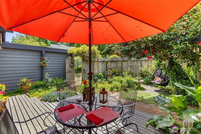 9716 Hunter Point Rd NW, Olympia, WA 98502 - wooden terrace featuring outdoor dining area and fence