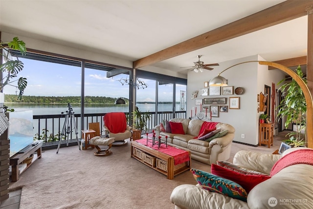9716 Hunter Point Rd NW, Olympia, WA 98502 - living area featuring carpet, a ceiling fan, a water view, and beam ceiling